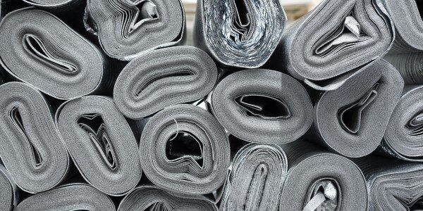 Stacks of rolled gray insulation